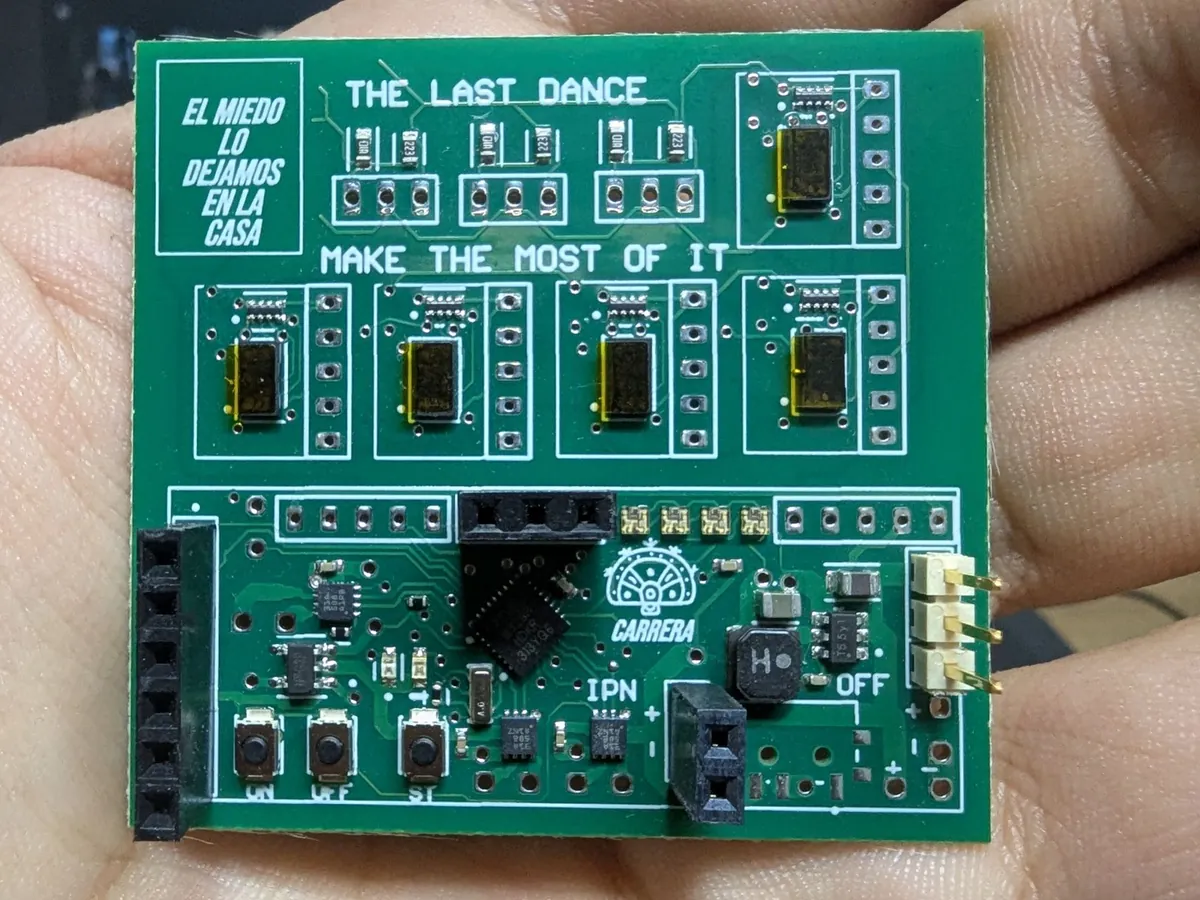 Assembled ESP32-S3 control PCB held in hand, showing its compact 47 by 20 millimetre footprint